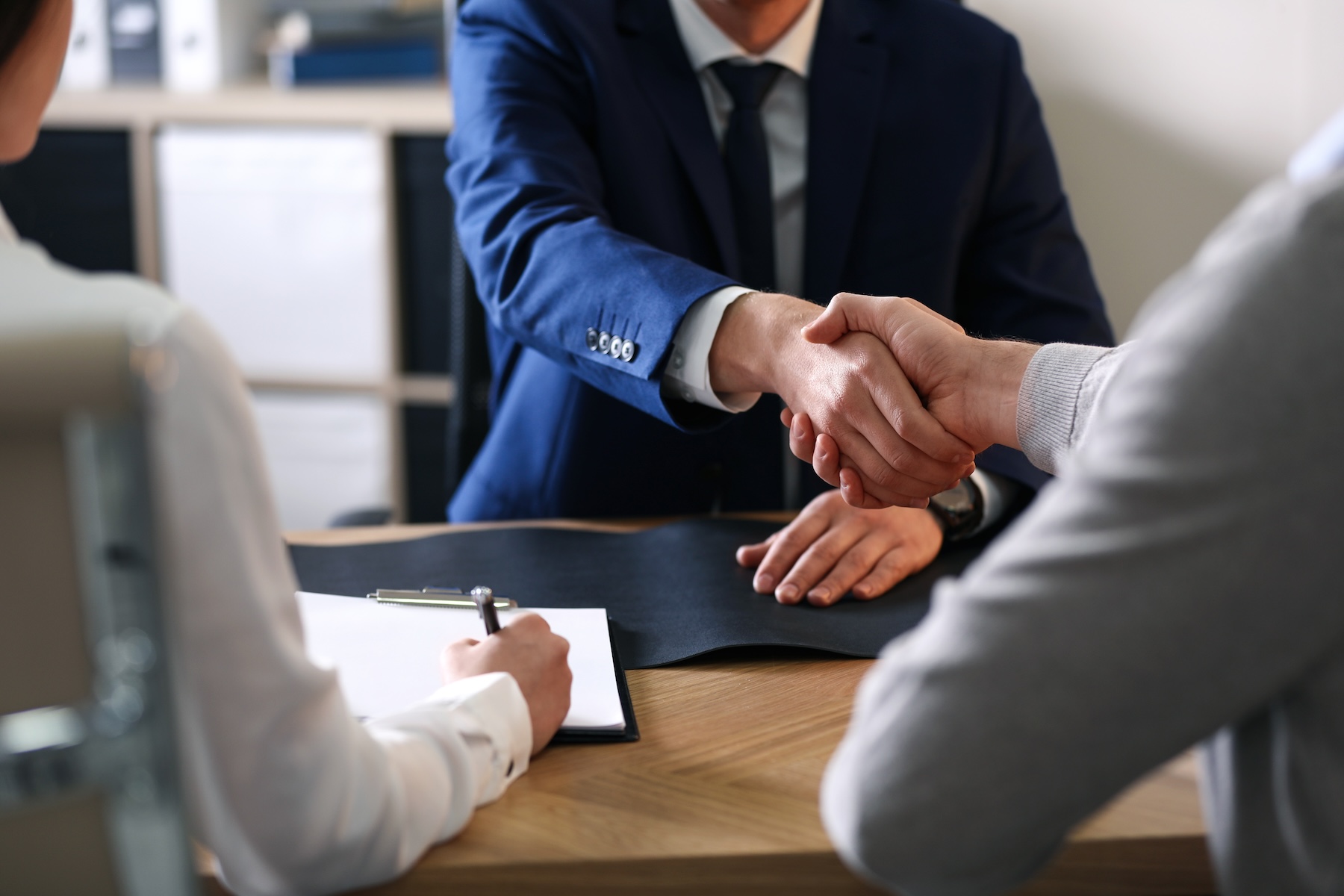 Lawyer working with clients in office, closeup