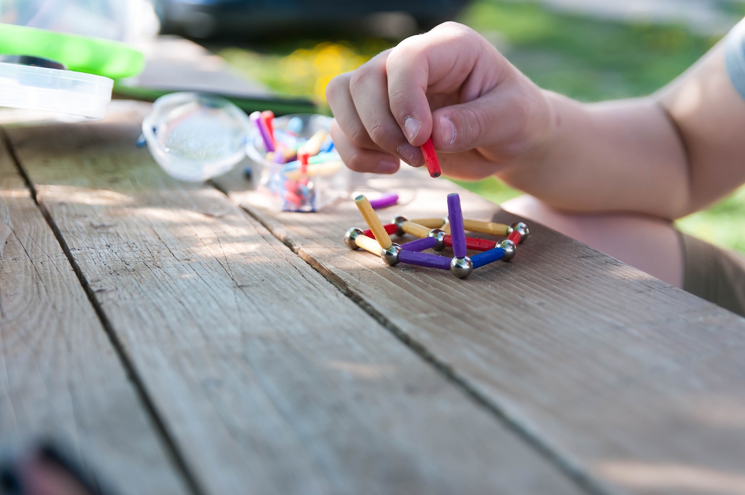 Boy playing with magnetic toys